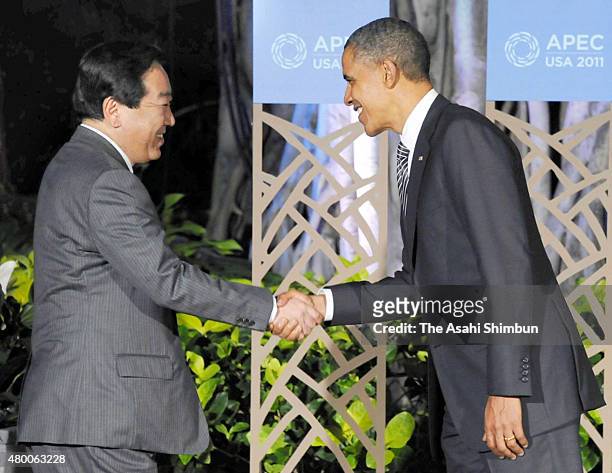 Japanese Prime Minister Yoshihiko Noda shakes hands with U.S. President Barack Obama at the Asia-Pacific Economic Cooperation Summit on November 12,...