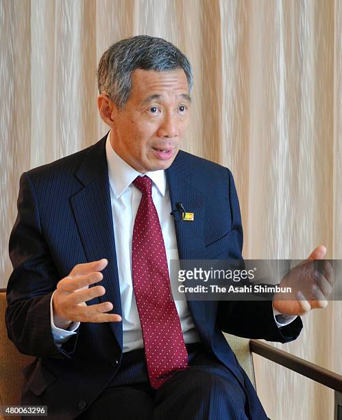 Singapore Prime Minister Lee Hsien Loong speaks during an interview during the Asia-Pacific Economic Cooperation Summit on November 13, 2011 in...