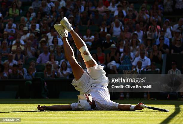 Jonathan Erlich of Israel falls at the net playing with partner Philipp Petzschner of Germany in the Gentlemens Doubles Semi Final match against John...