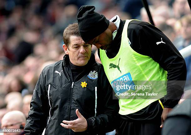 Newcastle United's assistant manager John Carver gives instructions to Shola Ameobi during the Barclays Premier League match between Newcastle United...