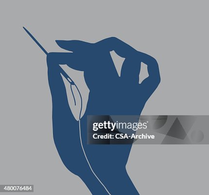Hand Holding Needle and Thread Hand Holding Needle and Thread
