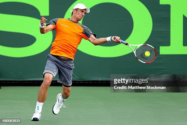 Jarrko Nieminen of Finland returns a shot to Alexandr Dolgopolov of Russia during the Sony Open at the Crandon Park Tennis Center on March 22, 2014...