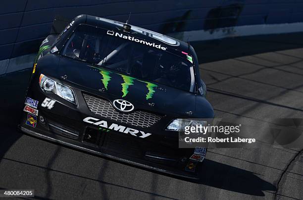 Kyle Busch, driver of the Monster Energy Toyota, races during the NASCAR Nationwide Series TREATMYCLOT.COM 300 at Auto Club Speedway on March 22,...