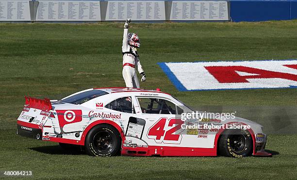 Kyle Larson, driver of the Cartwheel Chevrolet, celebrates after winning the NASCAR Nationwide Series TREATMYCLOT.COM 300 at Auto Club Speedway on...