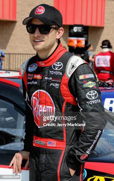 James Buescher, driver of the Rheem Toyota, looks on prior to the NASCAR Nationwide Series TREATMYCLOT.COM 300 at Auto Club Speedway on March 22,...