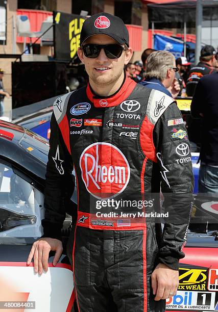 James Buescher, driver of the Rheem Toyota, looks on prior to the NASCAR Nationwide Series TREATMYCLOT.COM 300 at Auto Club Speedway on March 22,...