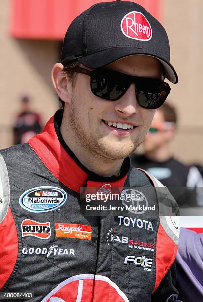 James Buescher, driver of the Rheem Toyota, looks on prior to the NASCAR Nationwide Series TREATMYCLOT.COM 300 at Auto Club Speedway on March 22,...