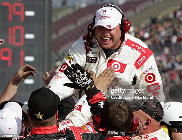 The crew of Kyle Larson, driver of the Cartwheel Chevrolet, celebrate after winning the NASCAR Nationwide Series TREATMYCLOT.COM 300 at Auto Club...