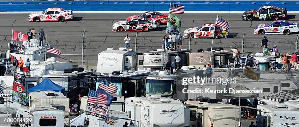 Kyle Larson, driver of the Cartwheel Chevrolet, leads a pack of cars during the NASCAR Nationwide Series TREATMYCLOT.COM 300 at Auto Club Speedway on...