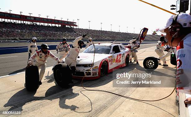 Kyle Larson, driver of the Cartwheel Chevrolet, pits during the NASCAR Nationwide Series TREATMYCLOT.COM 300 at Auto Club Speedway on March 22, 2014...