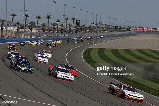 Brian Scott, driver of the Anderson's Maple Syrup Chevrolet, leads a pack of cars during the NASCAR Nationwide Series TREATMYCLOT.COM 300 at Auto...