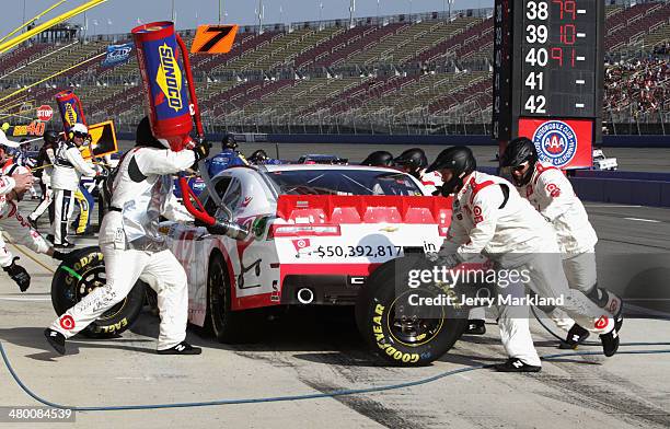 Kyle Larson, driver of the Cartwheel Chevrolet, pits during the NASCAR Nationwide Series TREATMYCLOT.COM 300 at Auto Club Speedway on March 22, 2014...