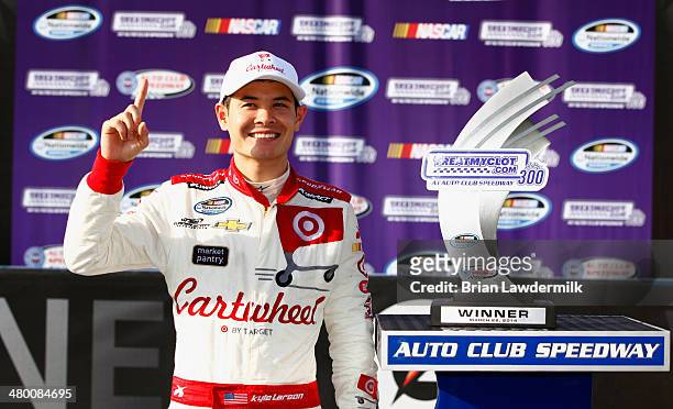 Kyle Larson, driver of the Cartwheel Chevrolet, celebrates in Victory Lane after winning the NASCAR Nationwide Series TREATMYCLOT.COM 300 at Auto...