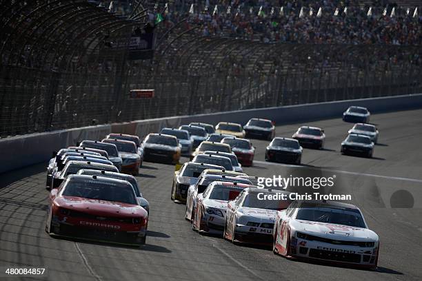 Kyle Larson, driver of the Cartwheel Chevrolet, leads the field during the NASCAR Nationwide Series TREATMYCLOT.COM 300 at Auto Club Speedway on...