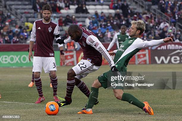 Marvell Wynne of Colorado Rapids and Gaston Fernandez of Portland Timbers battle for control of the ball at Dick's Sporting Goods Park on March 22,...