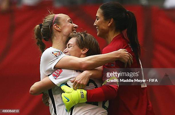 Becky Sauerbrunn of United States of America celebrates with Meghan Klingenberg and Hope Solo after winning the FIFA Women's World Cup 2015 final...