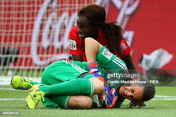 Nadine Angerer of Germany reacts in pain after a collision with Eniola Aluko of England during the FIFA Women's World Cup 2015 third place play-off...