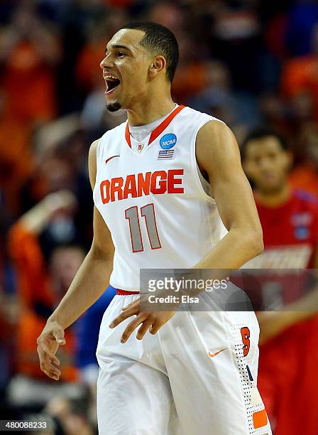 Tyler Ennis of the Syracuse Orange reacts against the Dayton Flyers during the third round of the 2014 NCAA Men's Basketball Tournament at the First...