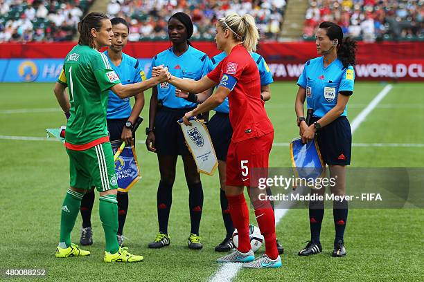 Nadine Angerer of Germany and Steph Houghton of England participate in the handshake for peace before the FIFA Women's World Cup 2015 third place...