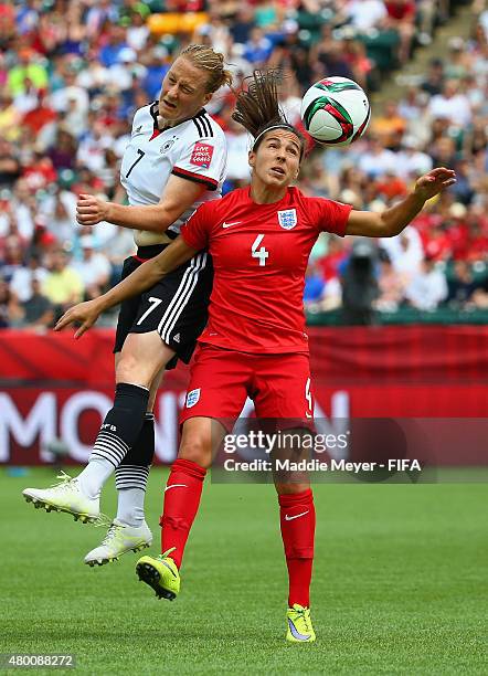 Melanie Behringer of Germany and Fara Williams of England compete for a header during the FIFA Women's World Cup 2015 third place play-off match...