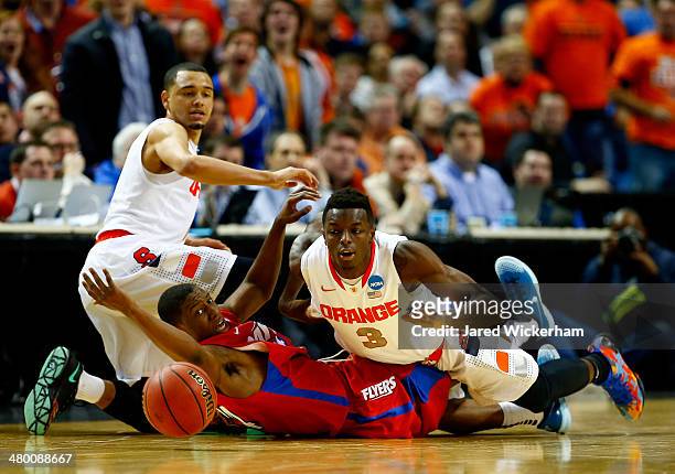 Jerami Grant of the Syracuse Orange and Jordan Sibert of the Dayton Flyers battle for a loose ball during the third round of the 2014 NCAA Men's...