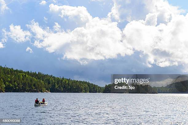 canoeing in sweden in summer - dalsland stock pictures, royalty-free photos & images