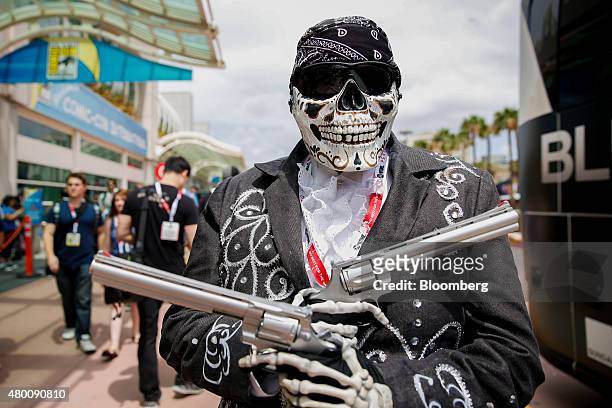 An attendee dressed as Activision Blizzard Inc.'s Call of Duty character Death Mariachi stands for a photograph during the Comic-Con International...