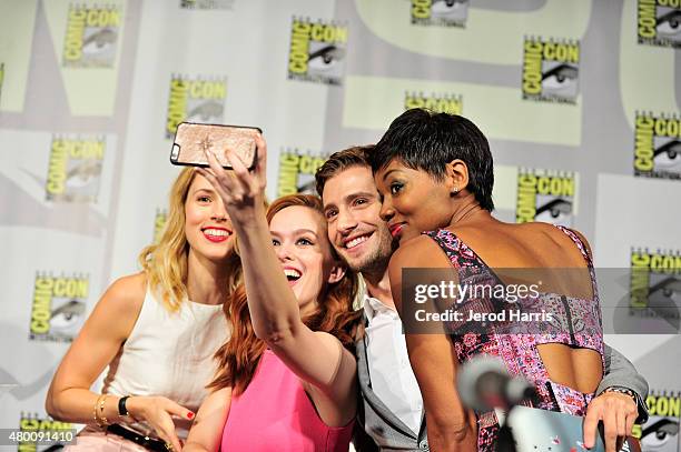 Actors Alona Tal, Elizabeth McLaughlin, Julian Morris and Emayatzy E. Corinealdi take a selfie onstage during Amazon Original Series 'Hand of God'...