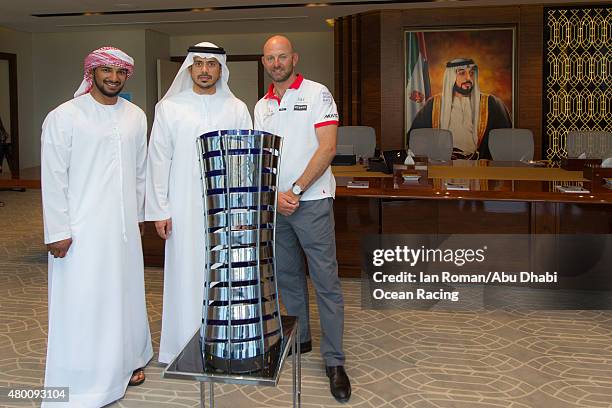 In this handout image provided by the Volvo Ocean Race, Abu Dhabi Ocean Racing's Adil Khalid and skipper Ian Walker with the Volvo Ocean Race trophy...