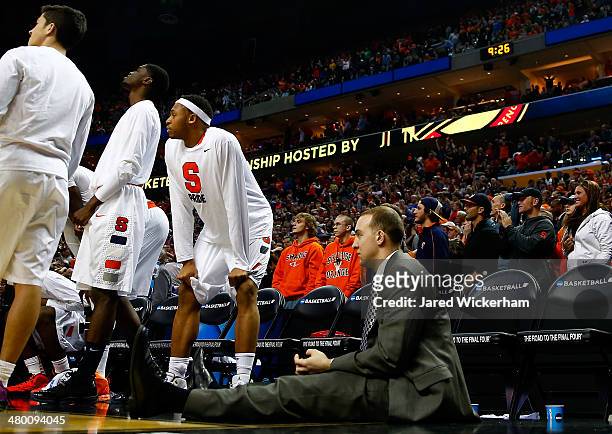 The Syracuse Orange bench looks after losing in the third round of the 2014 NCAA Men's Basketball Tournament against the Dayton Flyers at the First...