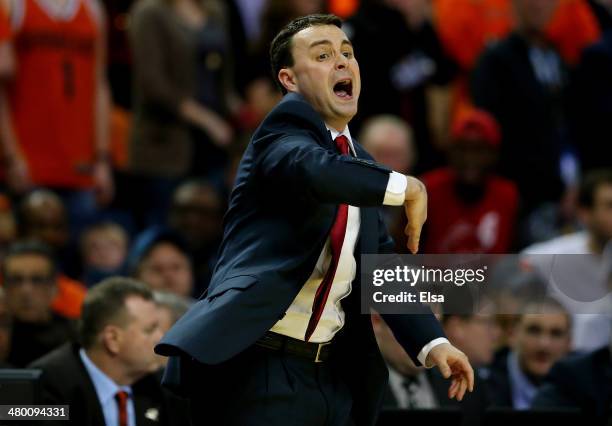 Head coach Archie Miller of the Dayton Flyers looks on during the third round of the 2014 NCAA Men's Basketball Tournament against the Syracuse...