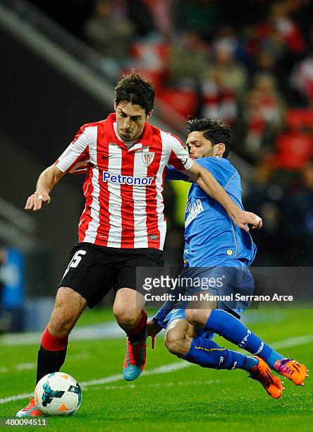 Andoni Iraola of Athletic Club duels for the ball with Angel Lafita of Getafe CF during the La Liga match between Athletic Club and Getafe CF at San...