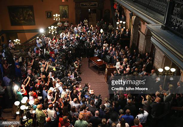Crowd applauds as South Carolina Governor Nikki Haley prepares to sign a bill to remove the Confederate flag from the statehouse on July 9, 2015 in...