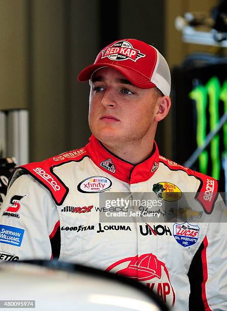 Ty Dillon, driver of the Red Kap/Alsco/Larry Miller Dealership Chevrolet, looks on during practice for the NASCAR XFINITY Series July Kentucky Race...