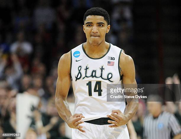 Gary Harris of the Michigan State Spartans celebrates a three-point shot in the second half against the Harvard Crimson during the Third Round of the...