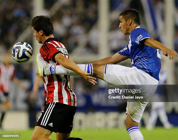 Guido Carrillo, of Estudiantes, and Fernando Tobio , of Velez Sarsfield, fight for the ball during a match between Velez Sarsfield and Estudiantes as...