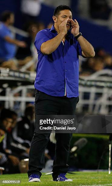 Jose Flores, coach of Velez Sarsfield, gives directions to his players during a match between Velez Sarsfield and Estudiantes as part of ninth round...