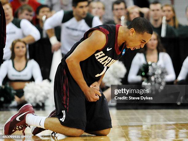 Siyani Chambers of the Harvard Crimson reacts after turning the ball over late in the second half against the Michigan State Spartans during the...