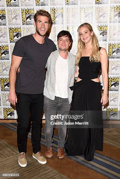 Actors Liam Hemsworth, Josh Hutcherson and Jennifer Lawrence of "The Hunger Games: Mockingjay - Part 2" attends the Lionsgate press room during...