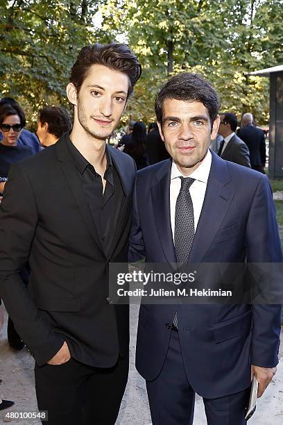 Pierre Niney, Jerome Lambert Montblanc CEO attend Montblanc Boheme Event Paris at Orangerie Ephemere on July 10, 2015 in Paris, France.