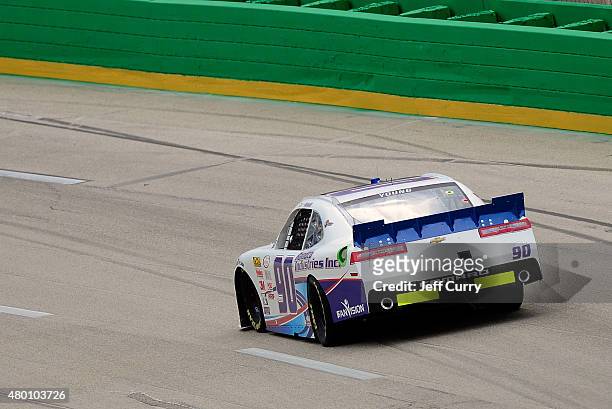 Jimmy Weller, driver of the Chevrolet, drives during practice for the NASCAR XFINITY Series July Kentucky Race at Kentucky Speedway on July 9, 2015...