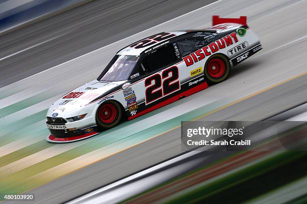 Brad Keselowski, driver of the Discount Tire Ford, drives during practice for the NASCAR XFINITY Series July Kentucky Race at Kentucky Speedway on...