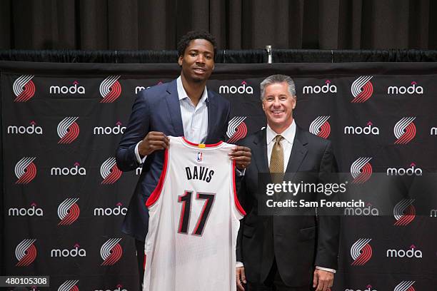 General Manager Neil Olshey of the Portland Trail Blazers welcomes new player Ed Davis during a press conference July 9, 2015 at the Trail Blazer...