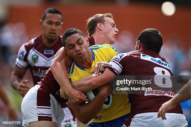 Willie Tonga of the Eels is tackled during the round three NRL match between the Manly-Warringah Sea Eagles and the Parramatta Eels at Brookvale Oval...