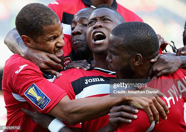 Sheldon Bateau of Trinidad & Tobago celebrates a first half goal against Guatemala with teammates including Radanfah Abu Bakr and Khaleem Hyland...