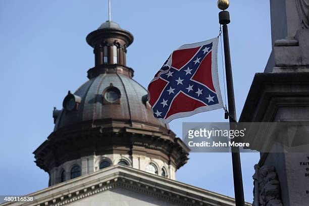 The Confederate flag flies in front of the South Carolina statehouse for the last full day on July 9, 2015 in Columbia, South Carolina. South...
