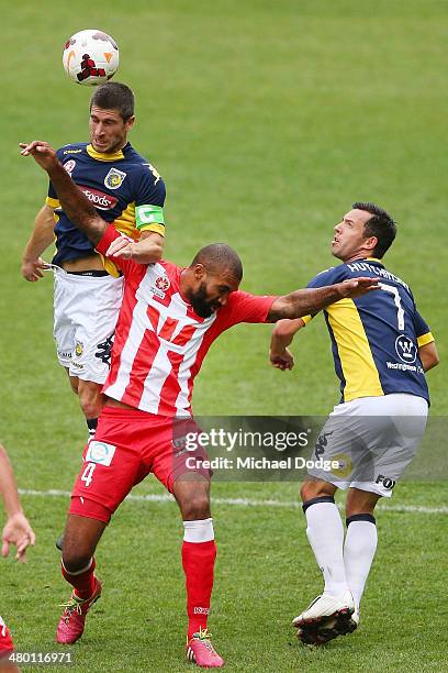 Nick Montgomery of the Mariners heads the ball over Orlando Engelaar of the Heart during the round 24 A-League match between Melbourne Heart and the...