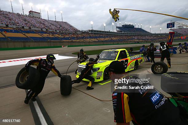 Matt Crafton, driver of the Ideal Door/Menards Toyota, pits during the NASCAR Camping World Truck Series UNOH 225 at Kentucky Speedway on July 9,...