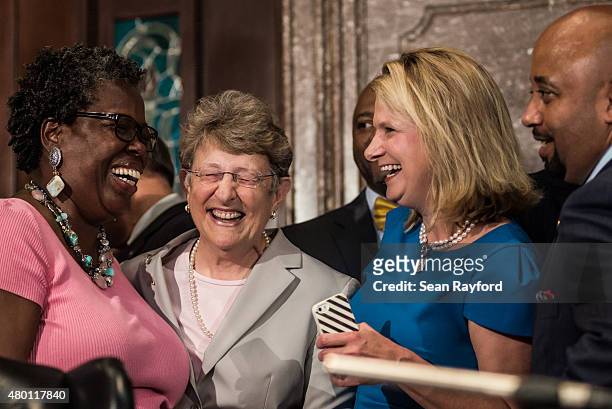 State Rep. Gilda Cobb-Hunter , South Carolina Supreme Court Chief Justice Jean Toal and Jenny Horn share a laugh at the state house July 9, 2015 in...