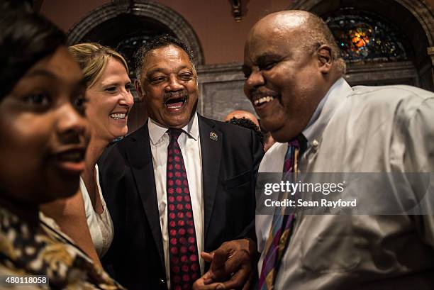 The Reverend Jesse Jackson shares a laugh with colleagues at the South Carolina state capitol building July 9, 2015 in Columbia, South Carolina. On...